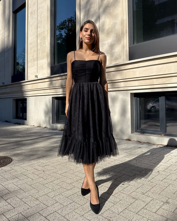 Black midi dress with draped bodice and straps