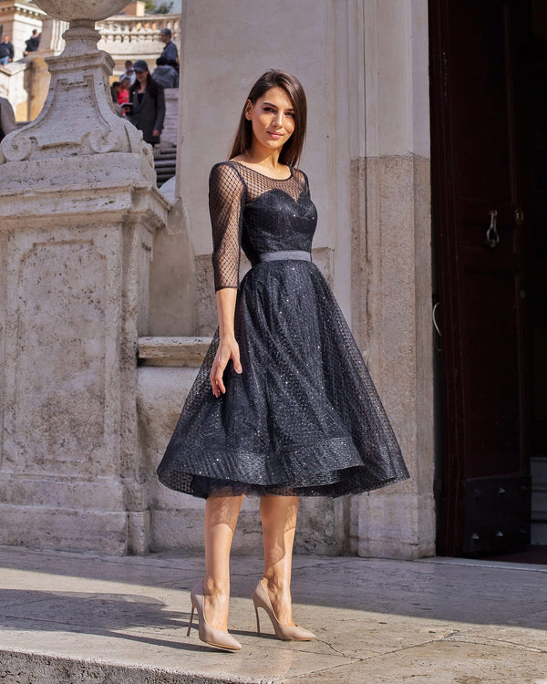 Shiny black evening dress with bodice and sleeves