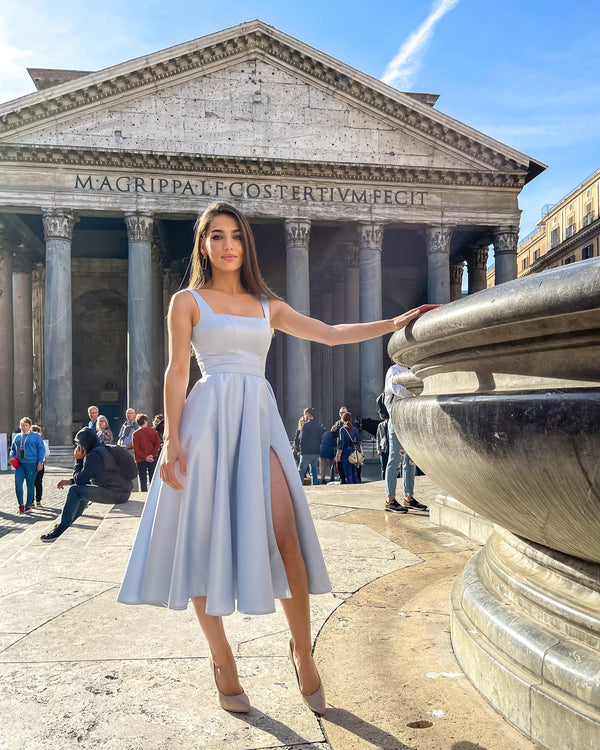 Elegant blue midi dress with slit and neckline